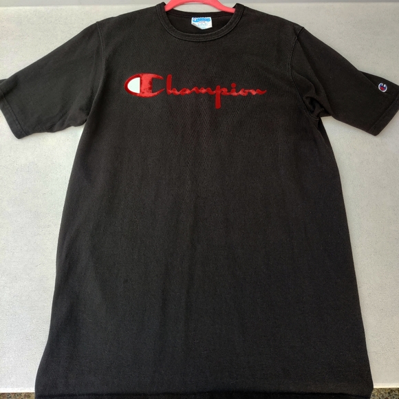 black champion shirt with red logo